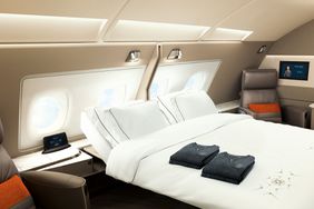 A Singapore Airlines A380 First Class Suite bed and pajamas