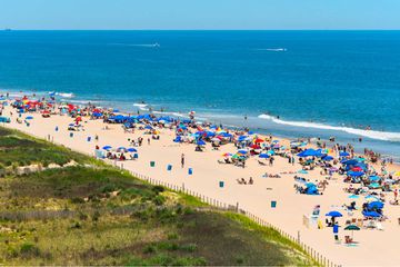 The beach in Ocean City Maryland, full on people and beach umbrellas