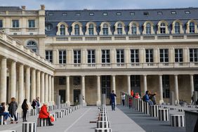 People sitting on Buren Columns