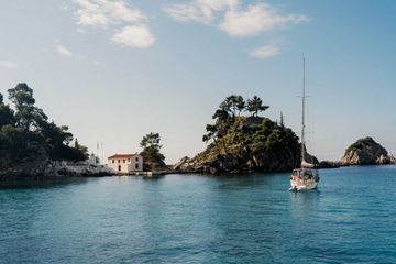 The coast of Parga, Greece, with a boat in the harbor