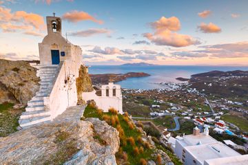 View of the harbor, Livadi village and Sifnos island in the distance from Chora, Serifos island in Greece.
